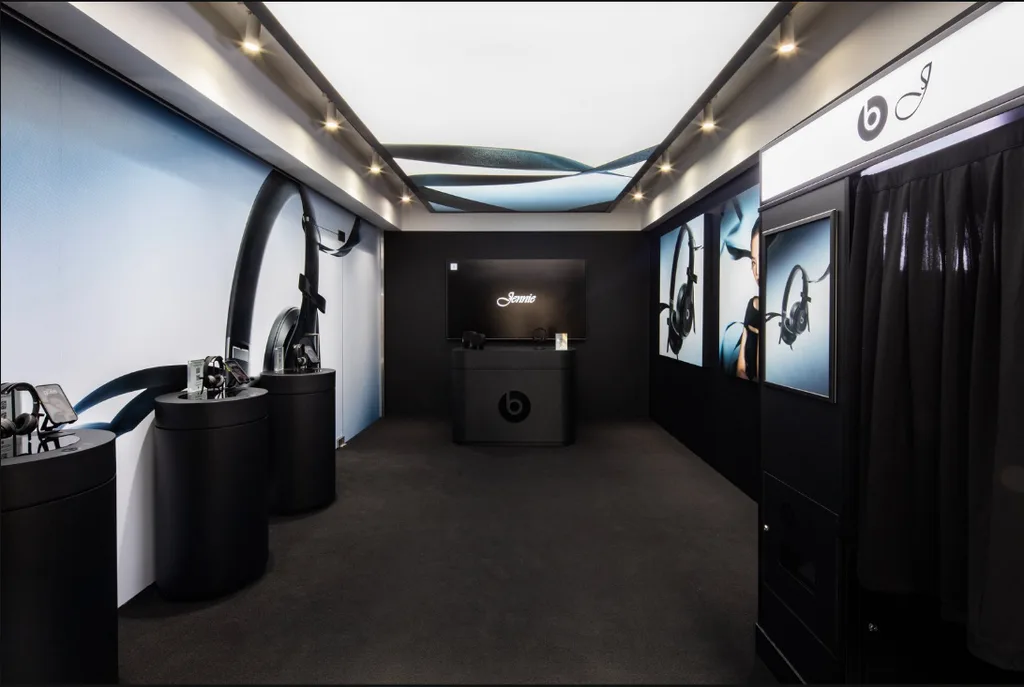 Second view of the Beats product experience space in Seoul, showing the display plinths and campaign visuals.