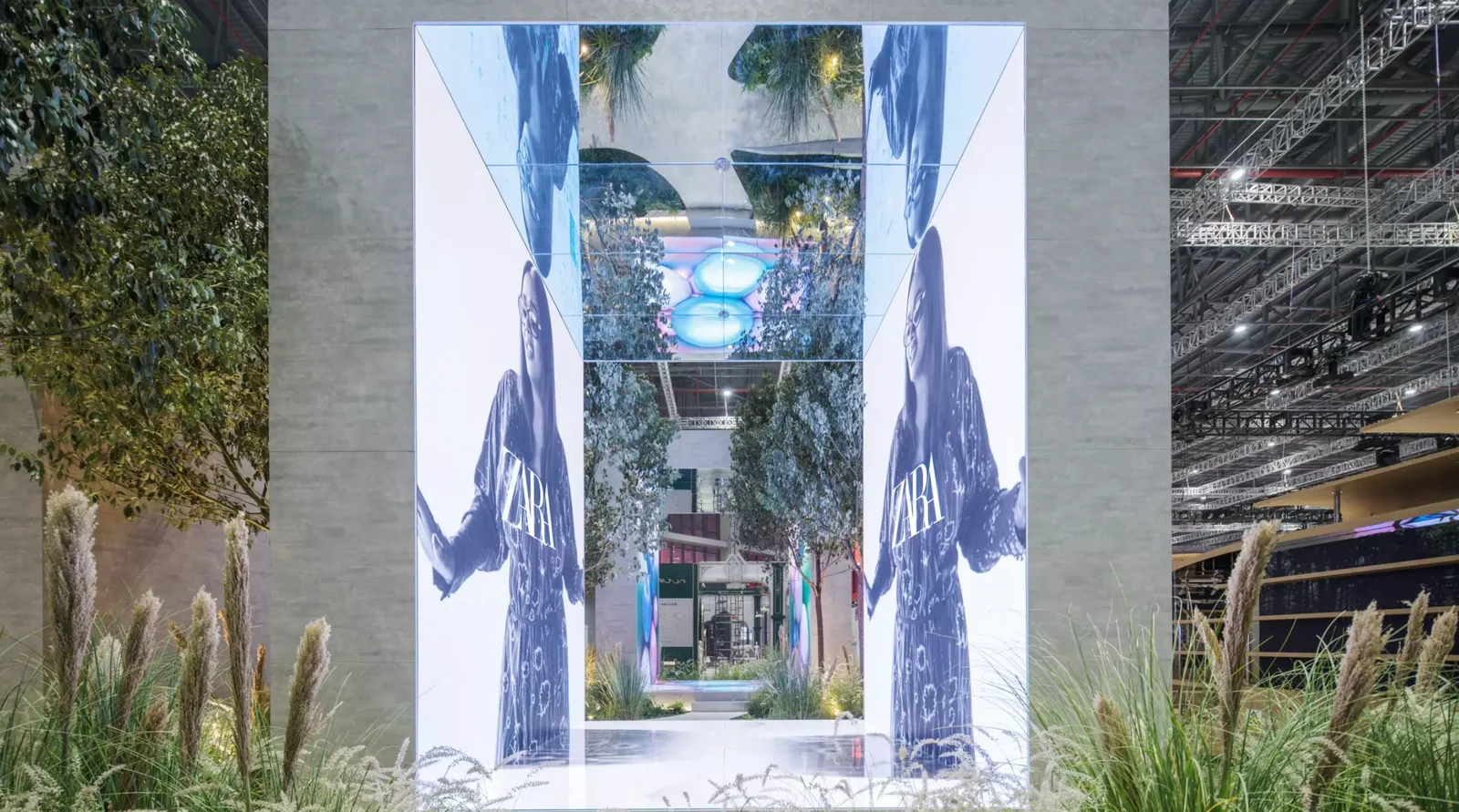 Immersive ZARA installation with mirrored LED surfaces and landscaped planting in Shanghai.